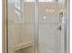 Large tiled shower with seat and glass enclosure at 1073 Fairhaven Dr # 52, Mebane, NC 27302