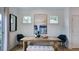 Bright dining area with a wooden table, modern chairs, and an abstract art piece at 109 Sepals Pl, Wendell, NC 27591