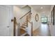 Bright foyer with wood staircase and wood-look flooring flows into the open living space at 109 Sepals Pl, Wendell, NC 27591