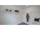 Large walk-in closet provides plenty of space for storage with wire shelves and closet rods at 109 Sepals Pl, Wendell, NC 27591