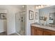 Bright bathroom features granite counters, double sinks, and a glass-enclosed shower at 111 Sepals Pl, Wendell, NC 27591