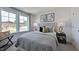 Relaxing bedroom with neutral tones, bedside tables, and large windows at 111 Sepals Pl, Wendell, NC 27591