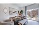 Elegant dining area with modern decor and natural light, flowing out to a patio area at 111 Sepals Pl, Wendell, NC 27591