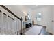 Inviting foyer featuring modern decor, a staircase, and a door leading to the outside at 111 Sepals Pl, Wendell, NC 27591