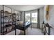 Home office boasts stylish shelving, a large desk, and natural light at 111 Sepals Pl, Wendell, NC 27591