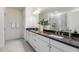 Double sink bathroom with framed shower and white cabinets at 1116 Ciandra Barn Way, Apex, NC 27523