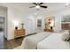 Bright bedroom with modern decor, features ceiling fan and natural light at 1116 Ciandra Barn Way, Apex, NC 27523