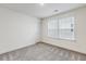 Bright bedroom with neutral carpet and plenty of natural light from the window at 1116 Ciandra Barn Way, Apex, NC 27523