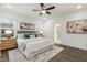 Bright bedroom features ceiling fan, comfy bed, and modern decor with natural light at 1116 Ciandra Barn Way, Apex, NC 27523
