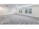 A huge carpeted bonus room with several windows for tons of natural light at 1116 Ciandra Barn Way, Apex, NC 27523
