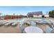 View of community pool with plenty of lounge chairs, tables and greenery, community amenities at 1116 Ciandra Barn Way, Apex, NC 27523