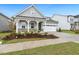 Lovely home with a well-manicured lawn, two-car garage, and inviting curb appeal at 1116 Ciandra Barn Way, Apex, NC 27523