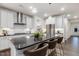 Modern kitchen with stainless steel appliances, an island with seating, and ample countertop space at 1116 Ciandra Barn Way, Apex, NC 27523