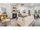 Comfortable living room featuring a fireplace, soft lighting, and stylish décor at 1116 Ciandra Barn Way, Apex, NC 27523
