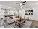 Open-concept living room with modern decor, neutral colors, and seamless flow into the kitchen at 1116 Ciandra Barn Way, Apex, NC 27523