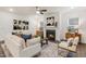 Elegant living room with cozy fireplace, stylish decor, and comfortable seating at 1116 Ciandra Barn Way, Apex, NC 27523