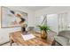 Inviting office space features wood desk, French doors, and neutral-toned furniture at 1116 Ciandra Barn Way, Apex, NC 27523