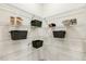 Organized pantry with white wire shelving and decorative storage baskets at 1116 Ciandra Barn Way, Apex, NC 27523