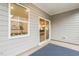 Covered patio with outdoor rug offers a relaxing outdoor space. Window provides natural light at 1116 Ciandra Barn Way, Apex, NC 27523