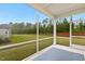 Screened patio provides an outdoor space with views of the expansive backyard at 1116 Ciandra Barn Way, Apex, NC 27523