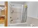 Bathroom featuring a shower and tub combination with neutral tile and fixtures at 11209 Sedgefield Dr, Raleigh, NC 27613