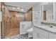 Bathroom featuring modern walk-in shower and granite countertops at 11209 Sedgefield Dr, Raleigh, NC 27613