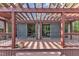 Features a deck with an attached pergola and sliding glass doors at 11209 Sedgefield Dr, Raleigh, NC 27613