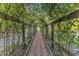 Arched garden tunnel with brick pathway, showcasing nature's beauty and creating a serene walkway at 11209 Sedgefield Dr, Raleigh, NC 27613