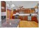 Well-equipped kitchen with stainless steel appliances, custom cabinetry, and a granite-topped island at 11209 Sedgefield Dr, Raleigh, NC 27613
