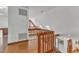 Open loft area with wood railing, skylights, and plenty of natural light at 11209 Sedgefield Dr, Raleigh, NC 27613