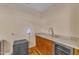 Convenient wet bar with granite countertops, wine fridge, and sink, perfect for entertaining at 11209 Sedgefield Dr, Raleigh, NC 27613