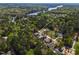 Aerial view of home and surrounding neighborhood with lake in the distance at 115 Buckskin Dr, Louisburg, NC 27549