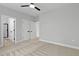 Neutral bedroom with carpet flooring, ceiling fan, closet and bathroom entrances at 115 Buckskin Dr, Louisburg, NC 27549
