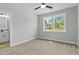 Bedroom with carpet flooring, natural light, and an ensuite bathroom at 115 Buckskin Dr, Louisburg, NC 27549
