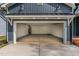Spacious, two-car garage with an open layout, white walls and direct access to the main house at 115 Buckskin Dr, Louisburg, NC 27549