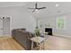 Cozy living room with a vaulted ceiling, a fireplace and a comfortable seating area at 115 Buckskin Dr, Louisburg, NC 27549