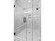 Contemporary shower features seamless glass doors, a bench, and decorative tile design at 115 Buckskin Dr, Louisburg, NC 27549