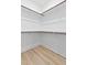 Walk-in closet features custom shelving, providing ample storage space and organization at 115 Buckskin Dr, Louisburg, NC 27549