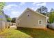 This fenced backyard shows a well-manicured lawn and patio area, perfect for entertaining at 117 Buena Vista Dr, Cary, NC 27513