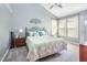Bright bedroom with vaulted ceiling, ceiling fan, and large window letting in natural light at 117 Buena Vista Dr, Cary, NC 27513