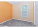 Smaller sized bedroom with neutral carpet, light colored walls, and single window at 117 Buena Vista Dr, Cary, NC 27513