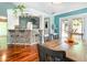 Open concept kitchen and dining area with breakfast bar and hardwood floors at 117 Buena Vista Dr, Cary, NC 27513