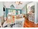 Open concept living room with hardwood floors, vaulted ceilings, and large windows for ample natural light at 117 Buena Vista Dr, Cary, NC 27513