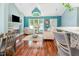 Open-concept living space with hardwood floors, fireplace, vaulted ceilings, and abundant natural light at 117 Buena Vista Dr, Cary, NC 27513