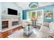 Inviting living room with fireplace, hardwood flooring, natural light, and comfortable seating at 117 Buena Vista Dr, Cary, NC 27513