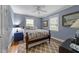 Comfortable bedroom with hardwood floors and soft blue walls at 119 Montgomery St, Raleigh, NC 27607