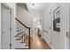 Inviting hallway showcasing hardwood floors and staircase leading upstairs at 119 Montgomery St, Raleigh, NC 27607