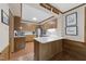 Charming kitchen with wood cabinets, quartz counters, and stainless appliances is move-in ready at 119 Montgomery St, Raleigh, NC 27607