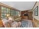 Cozy Gathering room featuring built-in shelving and large windows at 119 Montgomery St, Raleigh, NC 27607