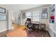 Comfortable home office with built-in shelving, hardwood floors, and natural light is a welcome workspace at 119 Montgomery St, Raleigh, NC 27607
